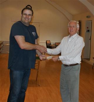 Paul presents a cheque for 150 raised for Sittingbourne MS to Smith Adams